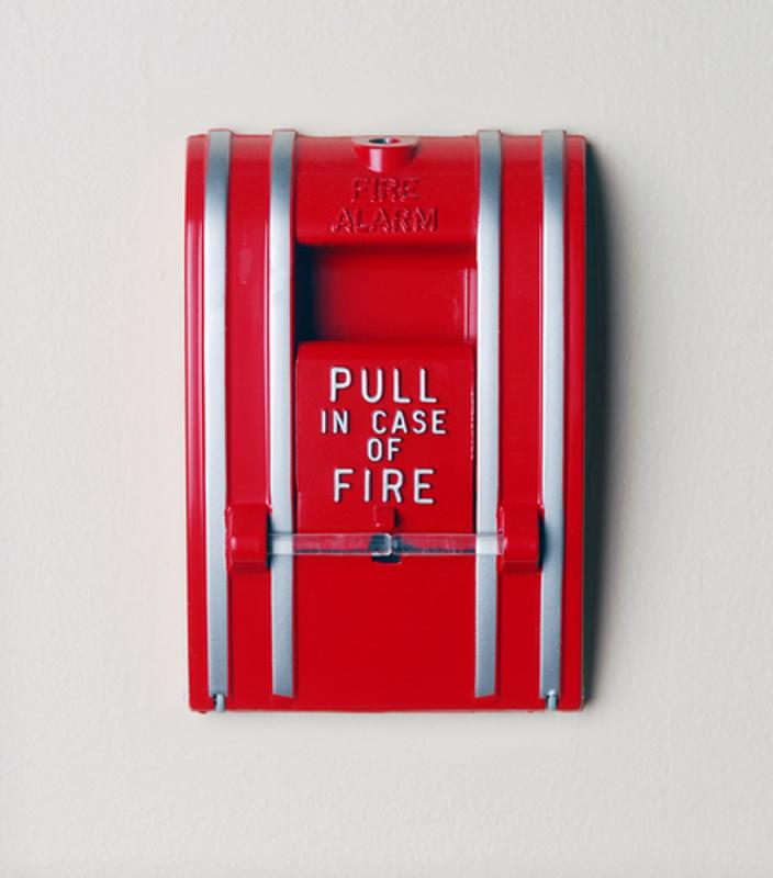 A fire alarm is installed on a wall.
