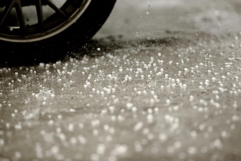 Tires roll over a concrete floor.